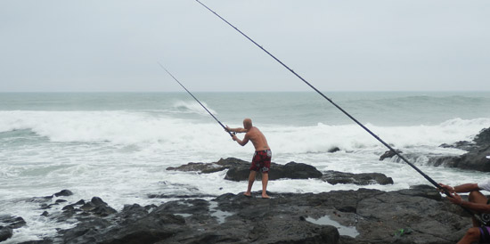 Fisherman in Port St Johns casting his line